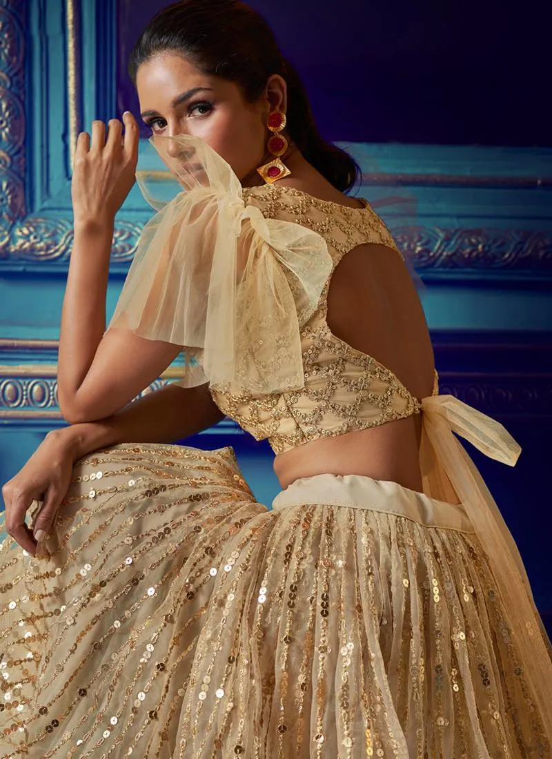 Admirable Beige Colored Soft Net Sequin And Zari Work Lehenga Choli